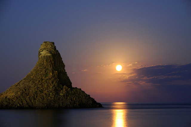 by gnuckx on Flickr.Aci Trezza Faraglioni moon rise, Islands of the Cyclops, Sicily, Italy.