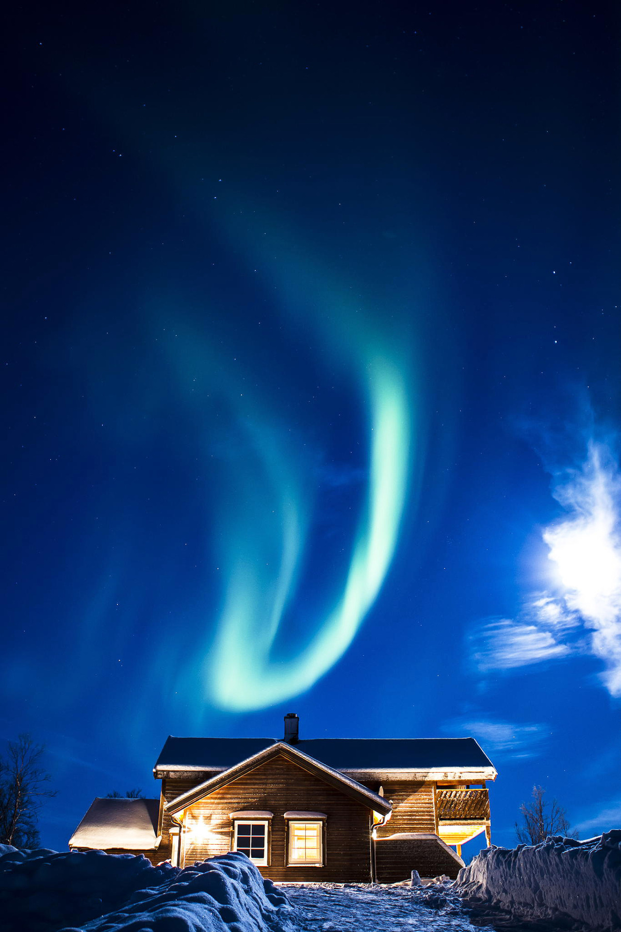 Aurora borealis above a cabin in Skaidi, Norway